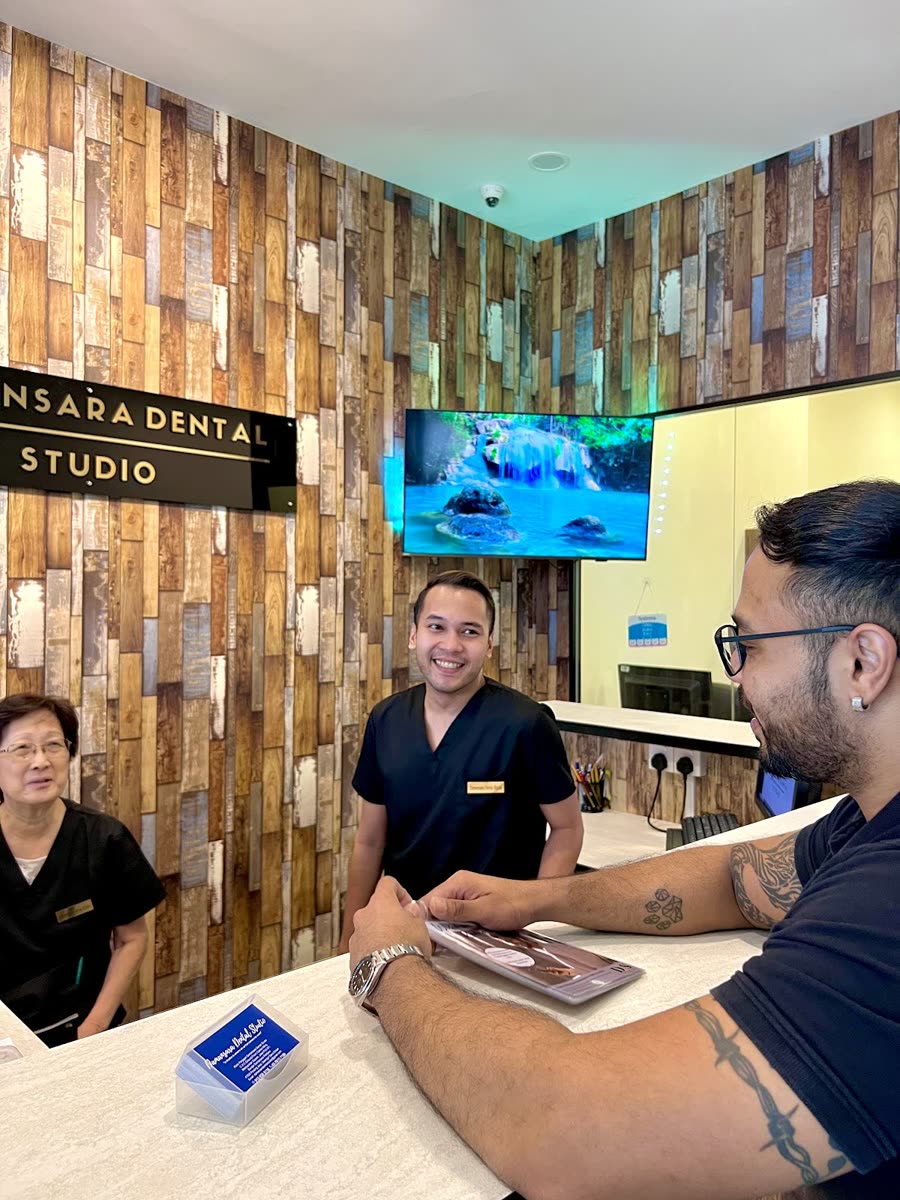 Our front desk team welcoming a patient at the reception
